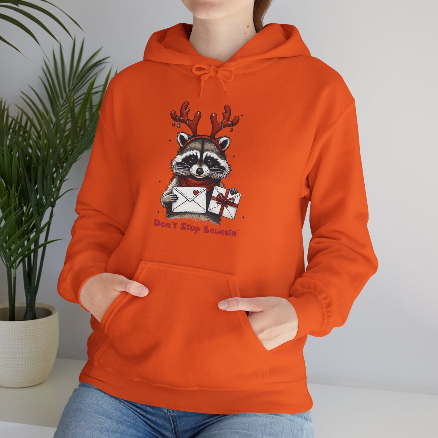 Christmas Raccoon Hoodie — 'Don't Stop Believin'' Festive Holiday Sweatshirt